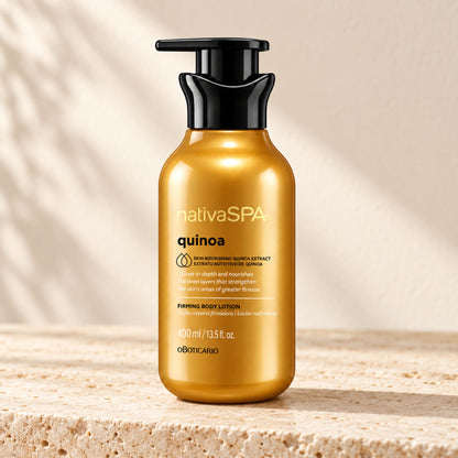 Flacon-pompe doré de lotion corps Nativa SPA Quinoa 400 ml sur une pierre claire